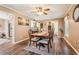 Dining room boasts hardwood floors, a classic table and chairs, and lots of light at 1522 Sprayberry Dr, Marietta, GA 30066
