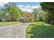 Charming two-story home with yellow siding, green shutters, and a well-manicured front lawn at 1522 Sprayberry Dr, Marietta, GA 30066