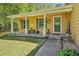 Inviting covered front porch with decorative touches, including shutters and a 'Welcome' sign at 1522 Sprayberry Dr, Marietta, GA 30066