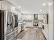 Updated kitchen boasts stainless steel appliances, granite countertops and ample cabinet space at 1522 Sprayberry Dr, Marietta, GA 30066
