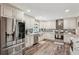 Modern kitchen with stainless steel appliances, granite countertops, and custom cabinetry at 1522 Sprayberry Dr, Marietta, GA 30066