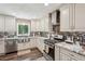 Updated kitchen boasts stainless steel appliances, granite countertops and ample cabinet space at 1522 Sprayberry Dr, Marietta, GA 30066