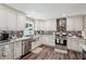 Updated kitchen boasts stainless steel appliances, granite countertops and ample cabinet space at 1522 Sprayberry Dr, Marietta, GA 30066