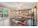 Bright living room with modern flooring, stone fireplace and slider to patio at 1522 Sprayberry Dr, Marietta, GA 30066