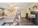 Cozy living room featuring hardwood floors, ceiling fan and comfortable couch at 1522 Sprayberry Dr, Marietta, GA 30066