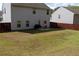 View of a spacious backyard featuring a lawn, patio, and a dark stained wooden fence at 20 Autumn Canyon Se Path, Cartersville, GA 30121