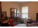 Cozy bedroom featuring neutral walls, window with blinds, and dark wood dresser at 20 Autumn Canyon Se Path, Cartersville, GA 30121