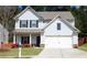 Charming two-story home with a well-manicured lawn and attached two-car garage at 20 Autumn Canyon Se Path, Cartersville, GA 30121