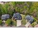 Aerial view of a well-kept house with manicured lawns surrounded by lush greenery at 439 Lake Point Trce, Canton, GA 30114