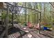 Picturesque backyard area featuring a pergola, patio seating, and landscaped features at 439 Lake Point Trce, Canton, GA 30114