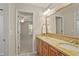 Bathroom with double sink vanity and large mirror with a view into another room at 439 Lake Point Trce, Canton, GA 30114
