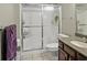 Bathroom featuring a vanity, toilet, and a sliding glass door shower at 439 Lake Point Trce, Canton, GA 30114