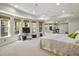 Spacious bedroom with large windows and a seating area at 439 Lake Point Trce, Canton, GA 30114