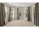 Bright bedroom featuring multiple windows with views and soft, neutral carpet at 439 Lake Point Trce, Canton, GA 30114