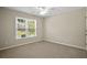 Bedroom featuring neutral walls, carpet flooring, and a window with a view at 439 Lake Point Trce, Canton, GA 30114