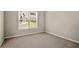 Bedroom with window, neutral walls, and carpet at 439 Lake Point Trce, Canton, GA 30114