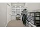 Walk-in closet features a built-in desk and shelving system and storage at 439 Lake Point Trce, Canton, GA 30114