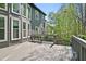 Spacious wooden deck overlooking the backyard with stairs at 439 Lake Point Trce, Canton, GA 30114