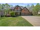 Inviting brick home with lush green lawn and manicured landscaping at 439 Lake Point Trce, Canton, GA 30114