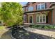 Charming front porch with decorative columns and lush landscaping at 439 Lake Point Trce, Canton, GA 30114