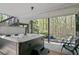 Covered patio with relaxing hot tub and wooded views at 439 Lake Point Trce, Canton, GA 30114