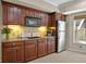 Traditional-style kitchen featuring wood cabinets, tile backsplash, and stainless steel appliances at 439 Lake Point Trce, Canton, GA 30114
