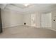 Spacious main bedroom featuring tray ceiling, neutral walls, and carpet at 439 Lake Point Trce, Canton, GA 30114