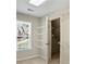 Walk-in closet with white wire shelving and natural light at 439 Lake Point Trce, Canton, GA 30114