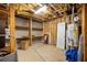 Unfinished basement shows exposed wooden beams, storage shelves, and water heater at 4420 Thorngate Ln, Acworth, GA 30101