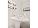 Powder room featuring pedestal sink, modern faucet, and rustic shelving at 4420 Thorngate Ln, Acworth, GA 30101