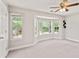 Bedroom showcasing a bay window, plush carpeting, and modern fixtures at 4420 Thorngate Ln, Acworth, GA 30101