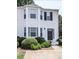 Exterior facade of a two-story home boasting lush landscaping and charming curb appeal at 4420 Thorngate Ln, Acworth, GA 30101