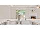 Close up view of the kitchen sink overlooking the backyard and fireplace at 4420 Thorngate Ln, Acworth, GA 30101