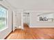 Inviting room features hardwood floors and kitchen access with natural light from windows at 4420 Thorngate Ln, Acworth, GA 30101