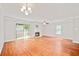 Large living area with hardwood floors, fireplace and large windows for natural light at 4420 Thorngate Ln, Acworth, GA 30101
