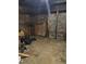 Unfinished basement featuring concrete walls and floor with some storage boxes at 1895 Thomasville Se Dr, Atlanta, GA 30315