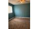 Bedroom with brown carpet, ceiling fan, and a window that provides natural light at 1895 Thomasville Se Dr, Atlanta, GA 30315