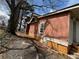 Side view of the home with siding and a small window at 1895 Thomasville Se Dr, Atlanta, GA 30315