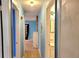 Hallway with bright blue walls, white trim and hardwood floors at 1895 Thomasville Se Dr, Atlanta, GA 30315