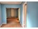 Interior shot showcasing a doorway with blue walls and hardwood floors at 1895 Thomasville Se Dr, Atlanta, GA 30315