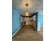 The kitchen has white cabinetry, a decorative light fixture, and hardwood floors at 1895 Thomasville Se Dr, Atlanta, GA 30315
