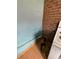 Close up of an electric range in a kitchen with brick and blue walls at 1895 Thomasville Se Dr, Atlanta, GA 30315