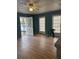Living Room with wood floor, natural light, and a front door leading outside at 1895 Thomasville Se Dr, Atlanta, GA 30315