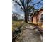View of the side yard showing the home's exterior and yard space at 1895 Thomasville Se Dr, Atlanta, GA 30315