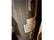 Close-up of a water heater with attached informational and warning labels at 1895 Thomasville Se Dr, Atlanta, GA 30315