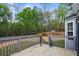Back deck with wood flooring overlooking a treed area at 2077 Alcovy Trace Way, Lawrenceville, GA 30045