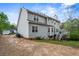 Two-story home featuring a spacious backyard and elevated wooden deck at 2077 Alcovy Trace Way, Lawrenceville, GA 30045