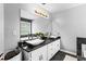 Bathroom boasts dual vessel sinks, ample cabinet storage, and a large vanity mirror at 2077 Alcovy Trace Way, Lawrenceville, GA 30045