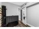 Minimalist bedroom with hardwood floors, gray walls and mirror door at 2077 Alcovy Trace Way, Lawrenceville, GA 30045