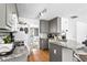 Well-lit kitchen with granite countertops, wood floors, and stainless steel appliances at 2077 Alcovy Trace Way, Lawrenceville, GA 30045
